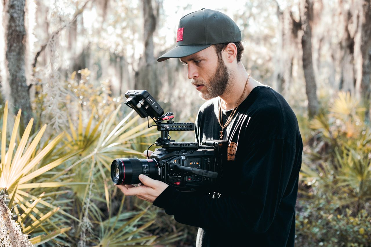 A filmmaker shooting with a cinema camera outdoors
